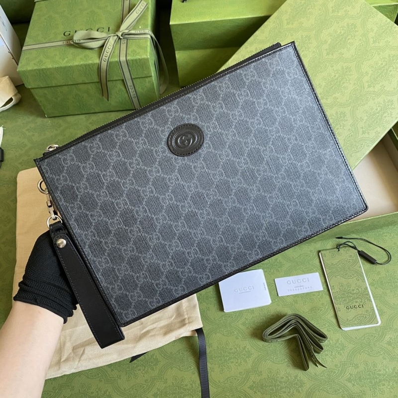 G*u*i clutch bags